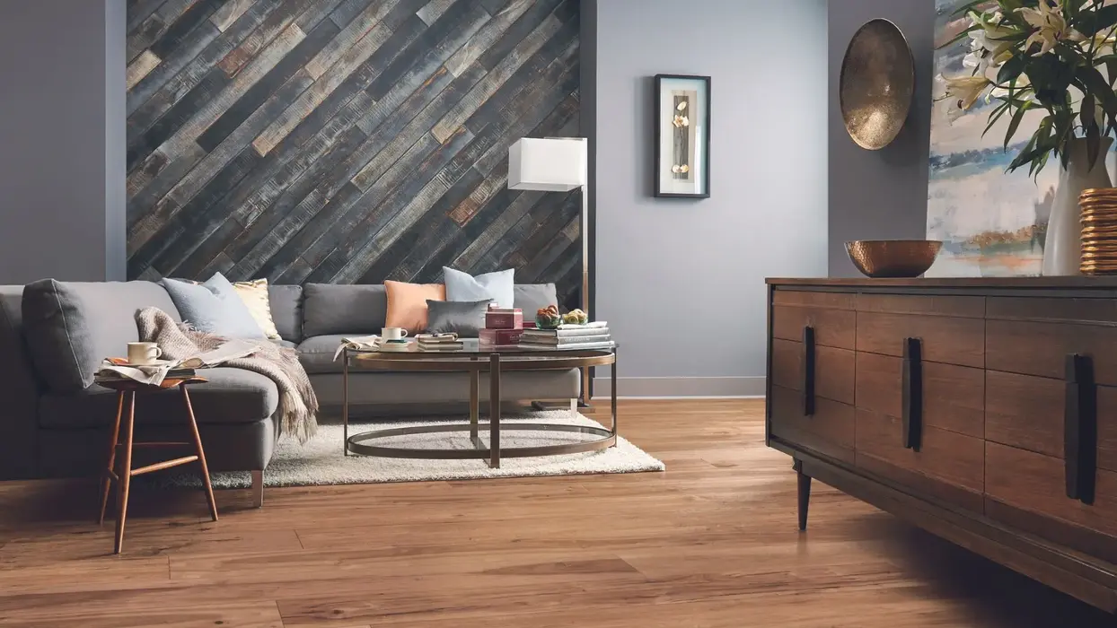 Wide plank oak living room with wood panel wall 