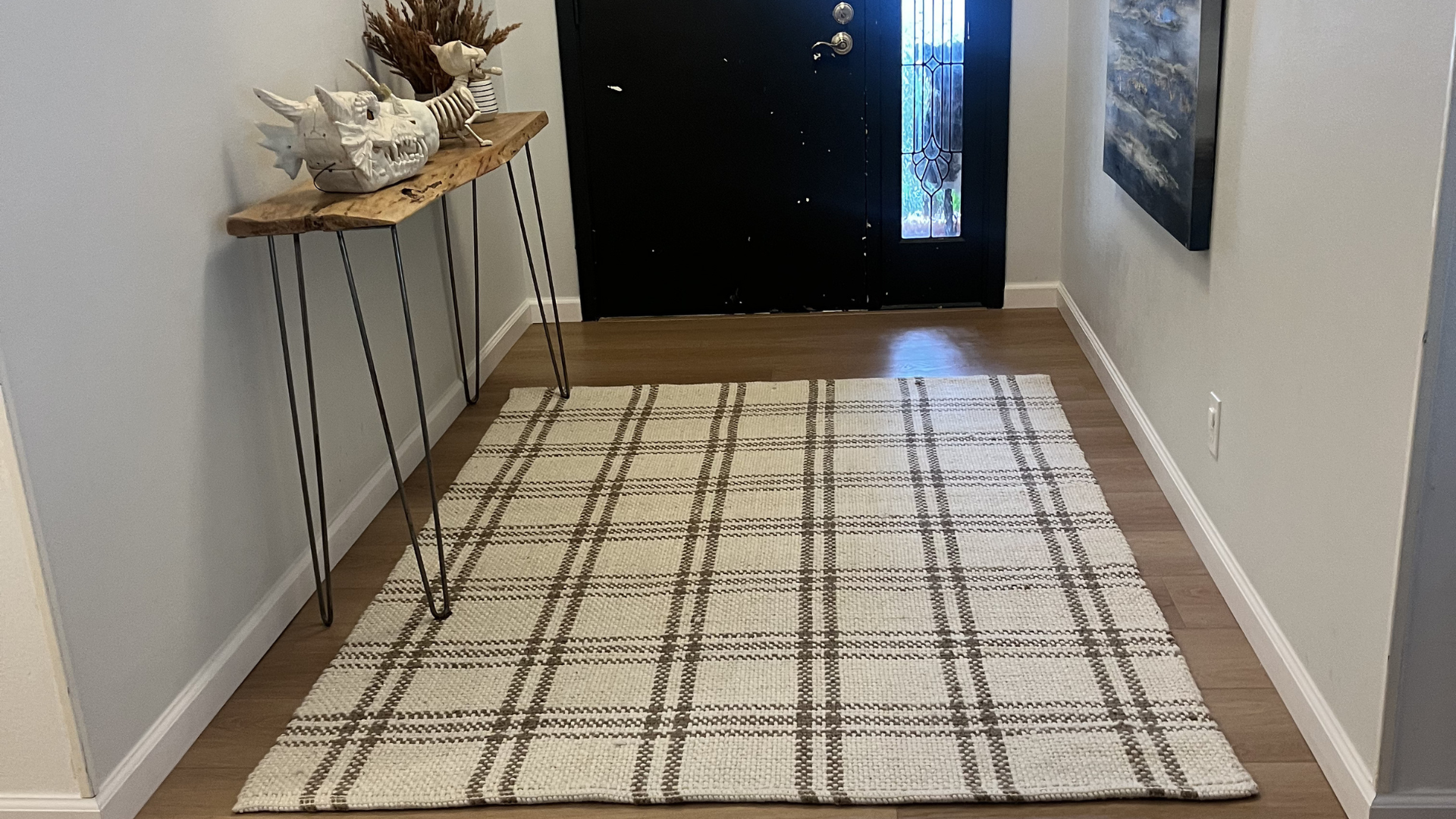 wood flooring in entryway with area rug in San Antonio, TX home